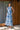 Vestido midi feminino Ferrache em tecido efeito linho com decote em V, botões frontais e cinto ajustável.