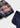 Conjunto Newborn Mayoral para menina com camisola vermelha em malha, calção xadrez e collants azul-marinho.