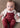 Conjunto Mayoral Newborn composto por body branco, casaco de malha jacquard e jardineiras bordeaux.