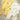 Conjunto Mayoral Newborn com dois babygrows de manga comprida, um branco estampado e outro amarelo com ursinho para bebé.