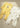 Conjunto Mayoral Newborn com dois babygrows de manga comprida, um branco estampado e outro amarelo com ursinho para bebé.