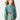 Vestido verde Mayoral para menina com estampado de menina e flores na parte frontal.
