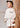 Conjunto Abel & Lula para menina composto por sweatshirt bege claro e saia coordenada.