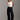 Jeans femininos Ferrache de cintura subida e perna larga em mistura de algodão, com cinco bolsos, costuras contrastantes e fecho frontal.