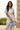 Blusa Ferrache em renda floral com mangas onduladas